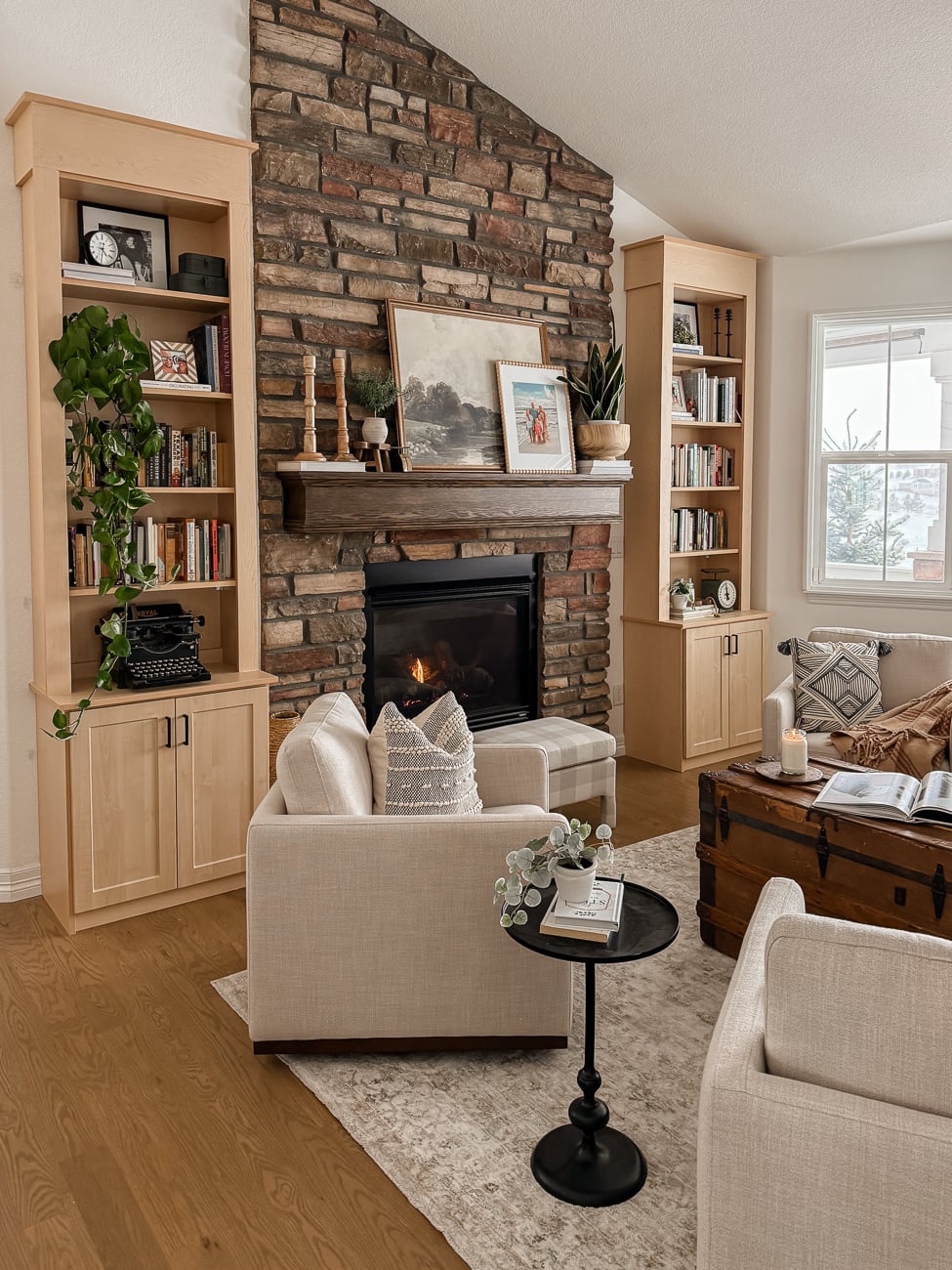 Bookshelves in the Front Room! Cozy sitting room with bookshelves on either side of fireplace.