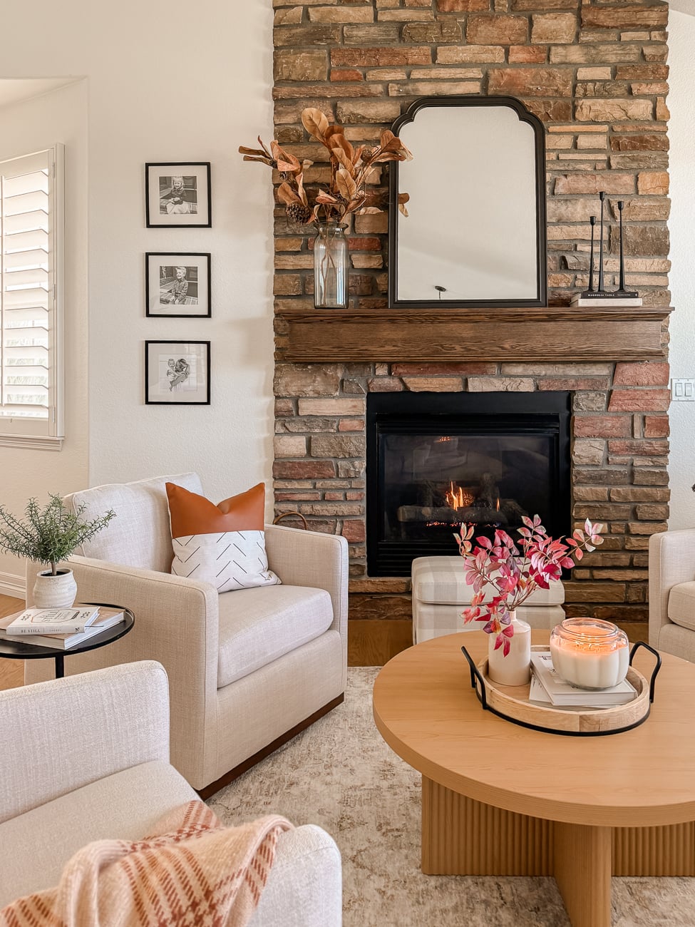 Cozy front sitting room. Family room with stone fireplace. Traditional decor.