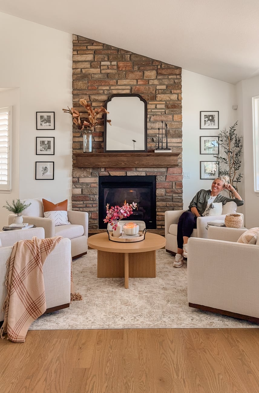 Cozy front sitting room. Family room with stone fireplace. Traditional decor.