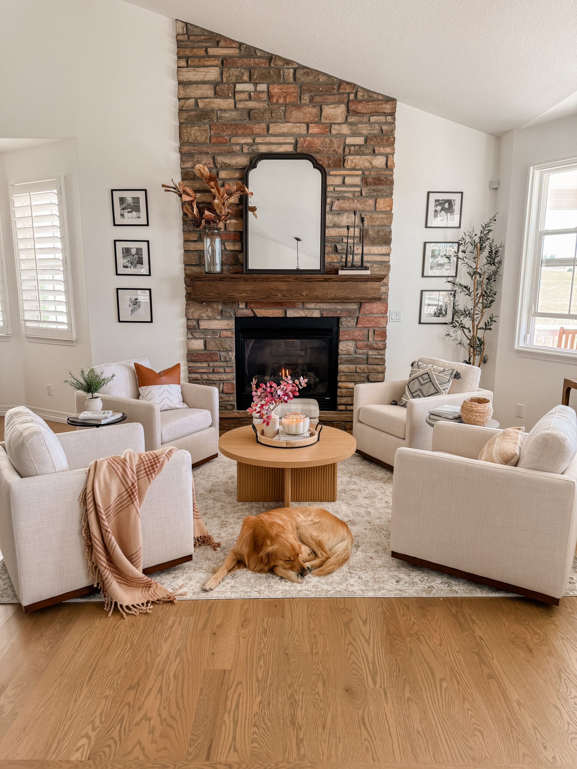 Cozy front sitting room. Family room with stone fireplace. Traditional decor.