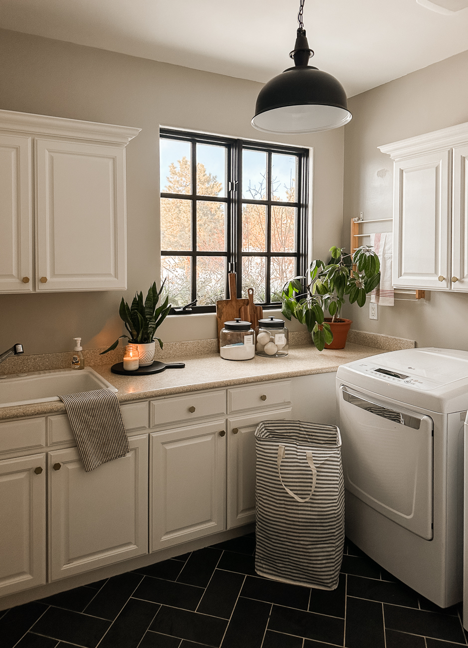 Laundry room idea with black painted window.